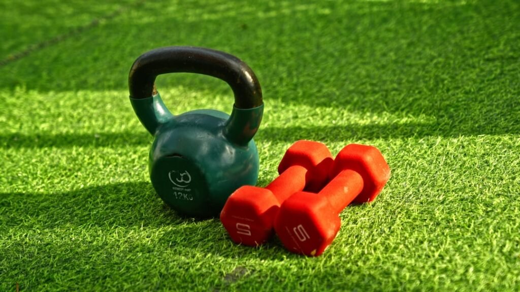 Kettlebell and dumbbells set up for a muscle building workout program